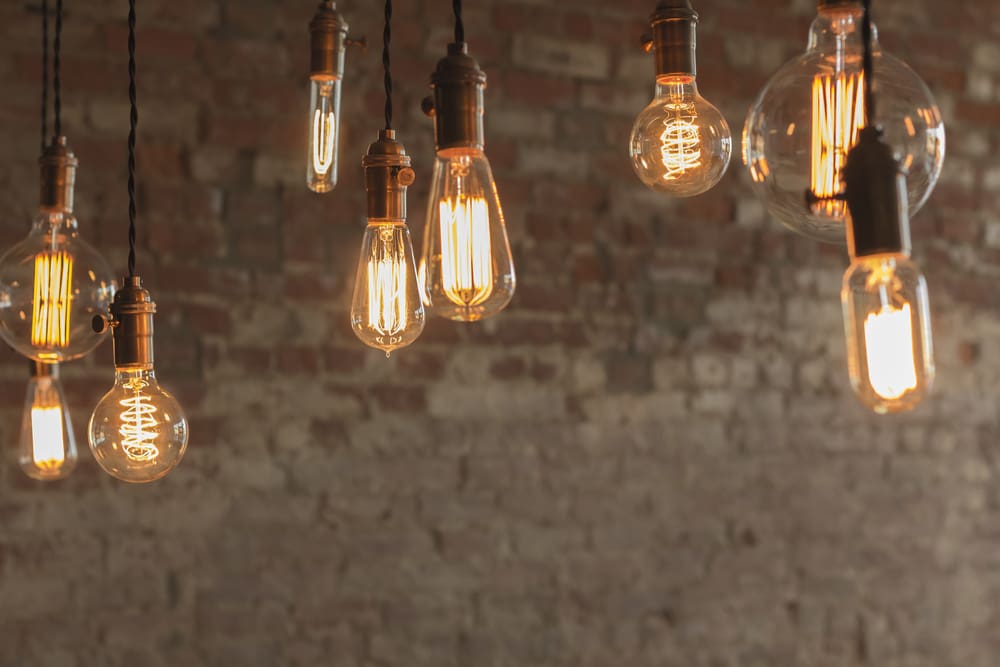 Vintage light bulbs against brick wall