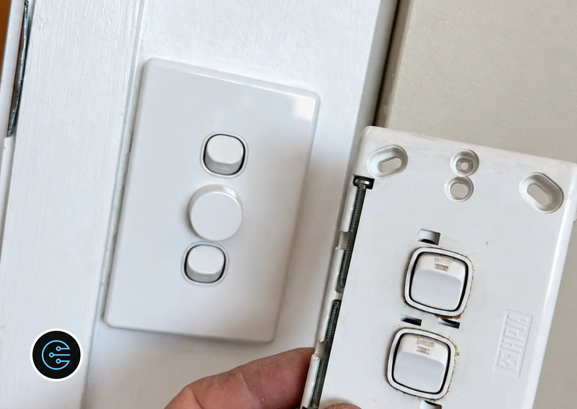 New Clipsal dimmer and switch plate on the wall beside the old switch plate removed in Malvern