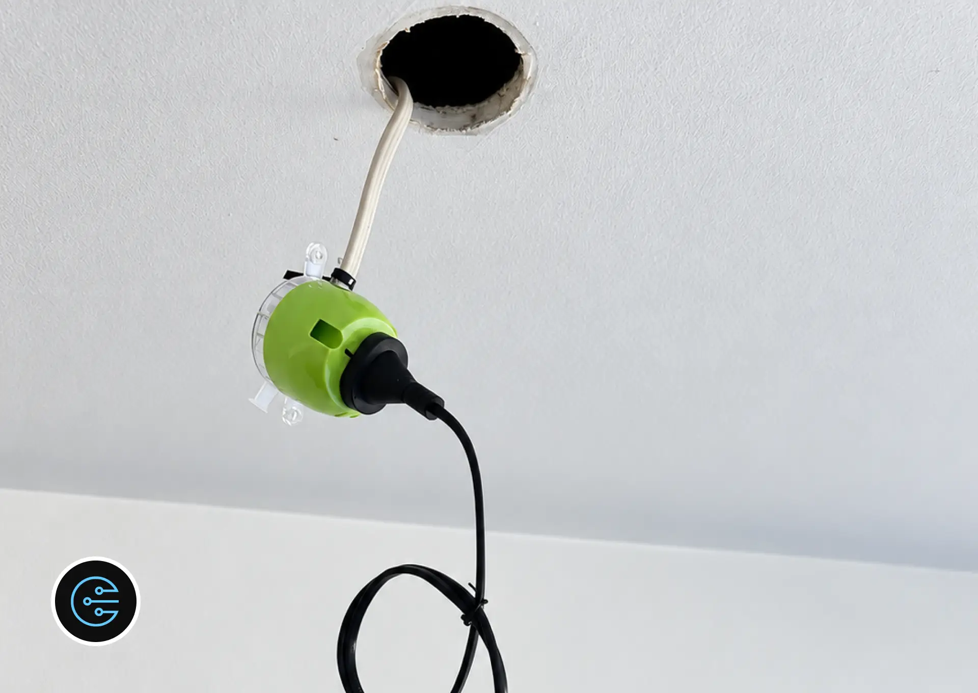 Green plug-in connector and cable ready for a new LED downlight in a Malvern ceiling